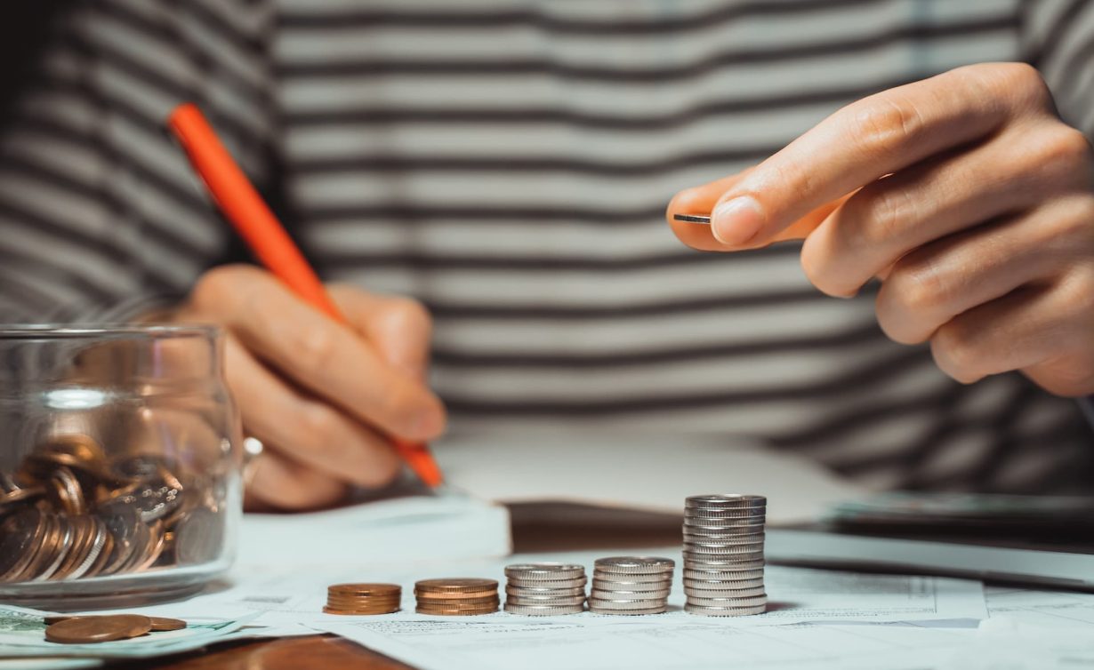 male-businessman-calculating-stacking-coin-saving-2022-03-02-13-18-07-utc(1)